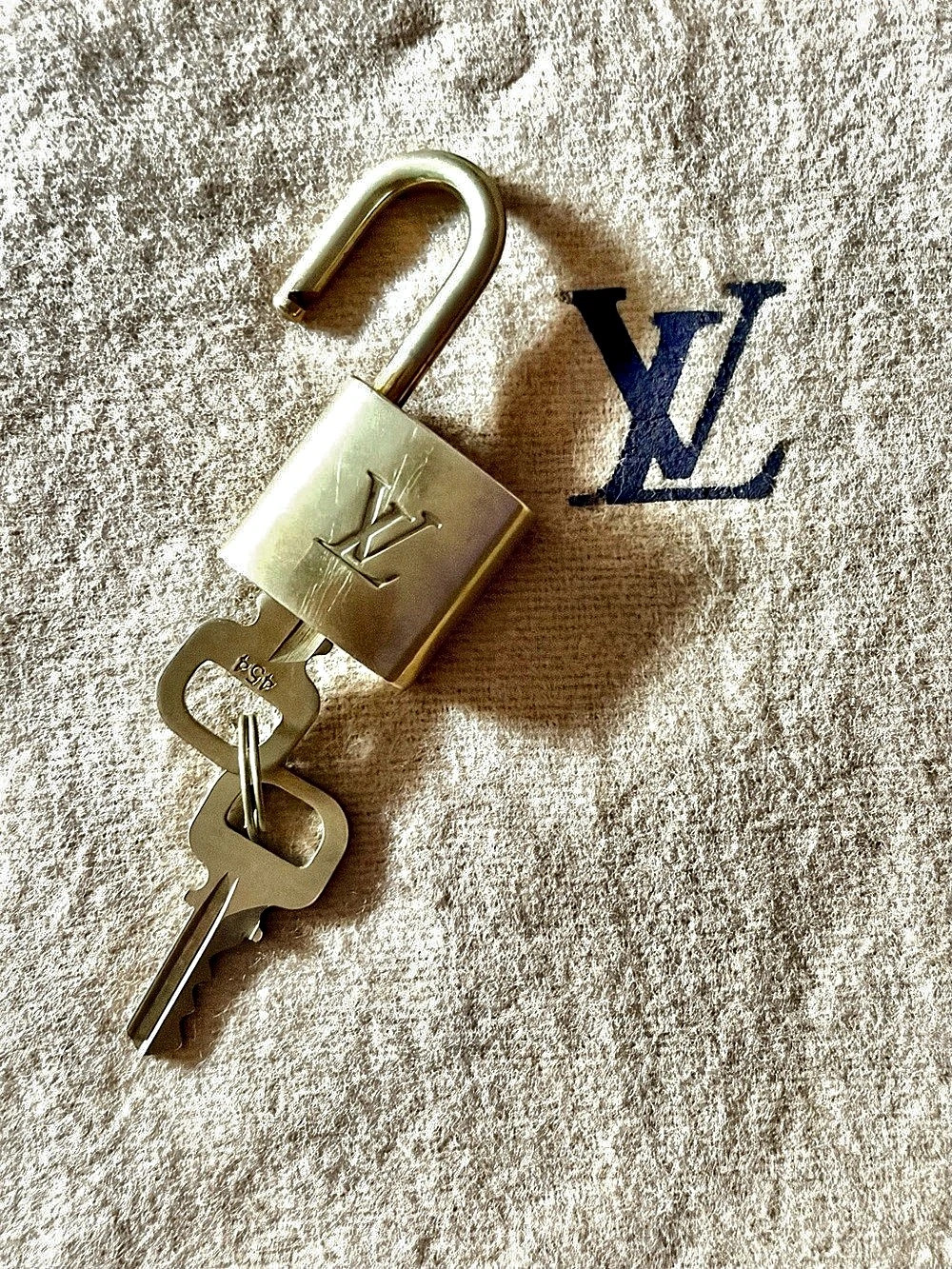 Louis Vuitton Monogram Pouch with Lock and key .